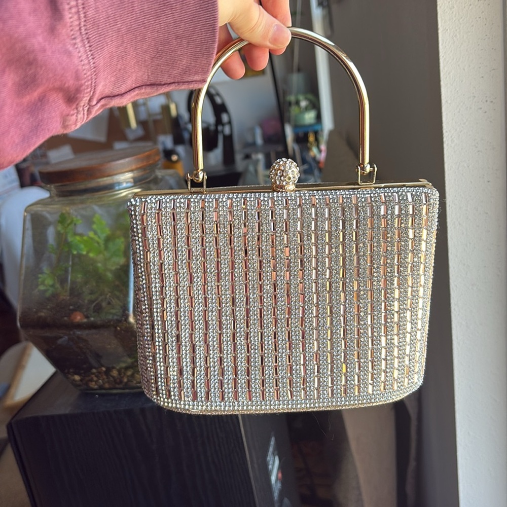 Small gold/sequins dressy evening bag, gold handle, snap closure.  New.